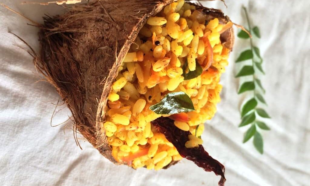 mango rice served in a coconut shell