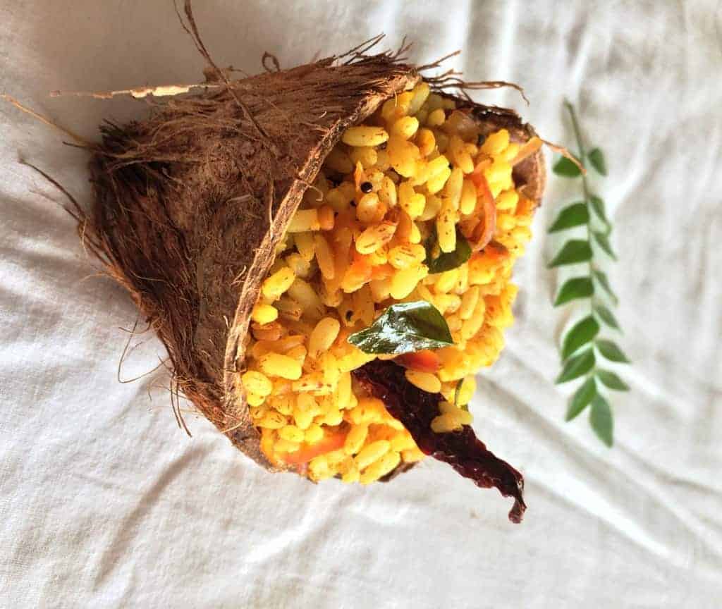 mango rice served in a coconut shell