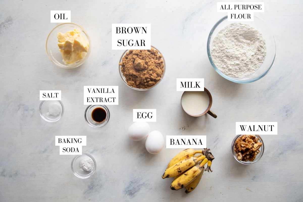 Picture of all the ingredients for Brown Butter Banana Bread with text to identify them