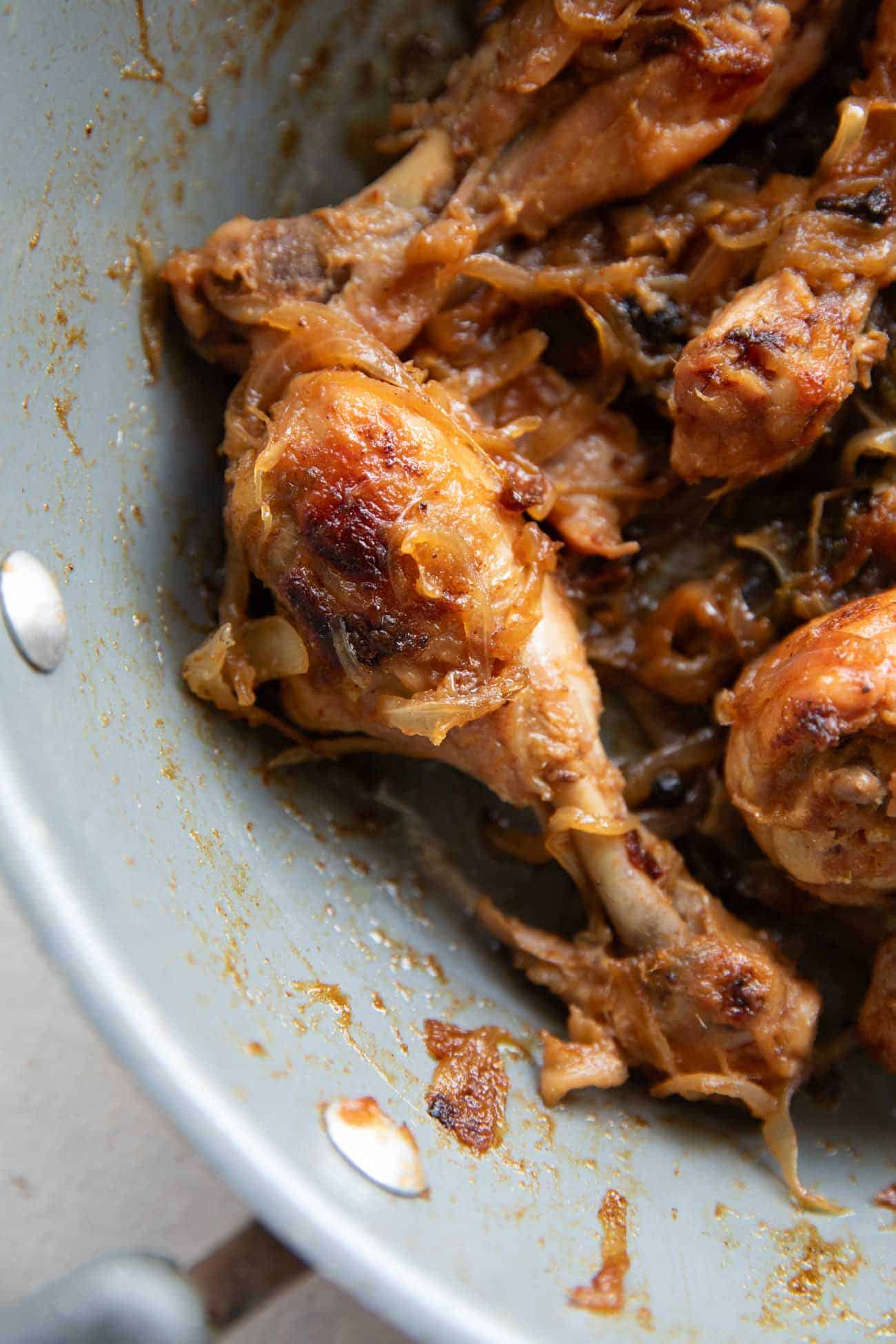 Chicken with caramelized onions in a pan