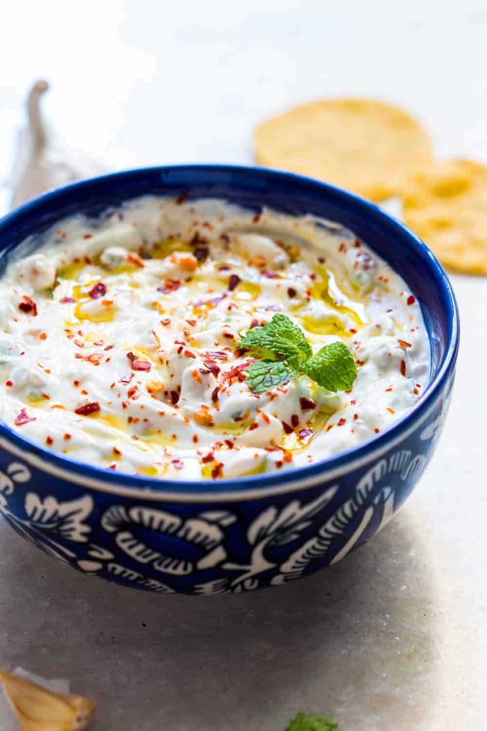 A light, refreshing and super addictive garlicky yogurt party dip to go with chips, wings, cutlets, fries and other finger food. Low calorie and healthy too.