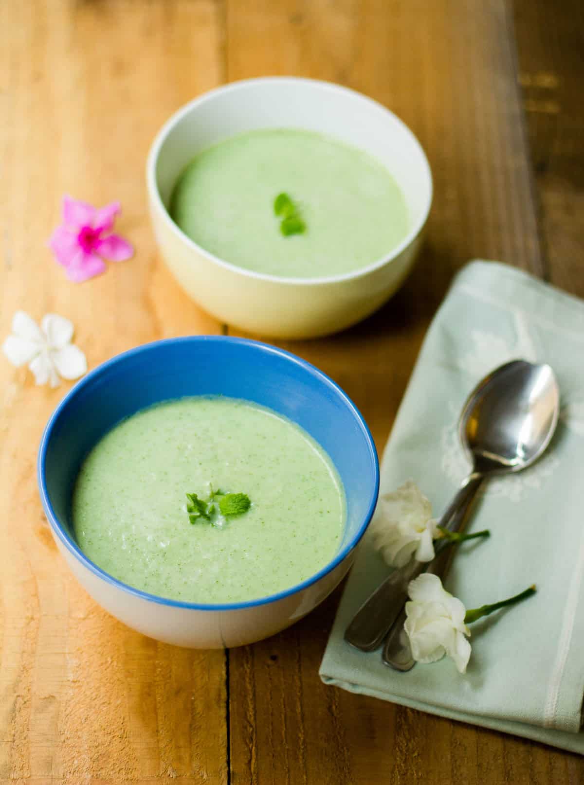 A picture of Chilled Cucumber Soup served in two bowls.