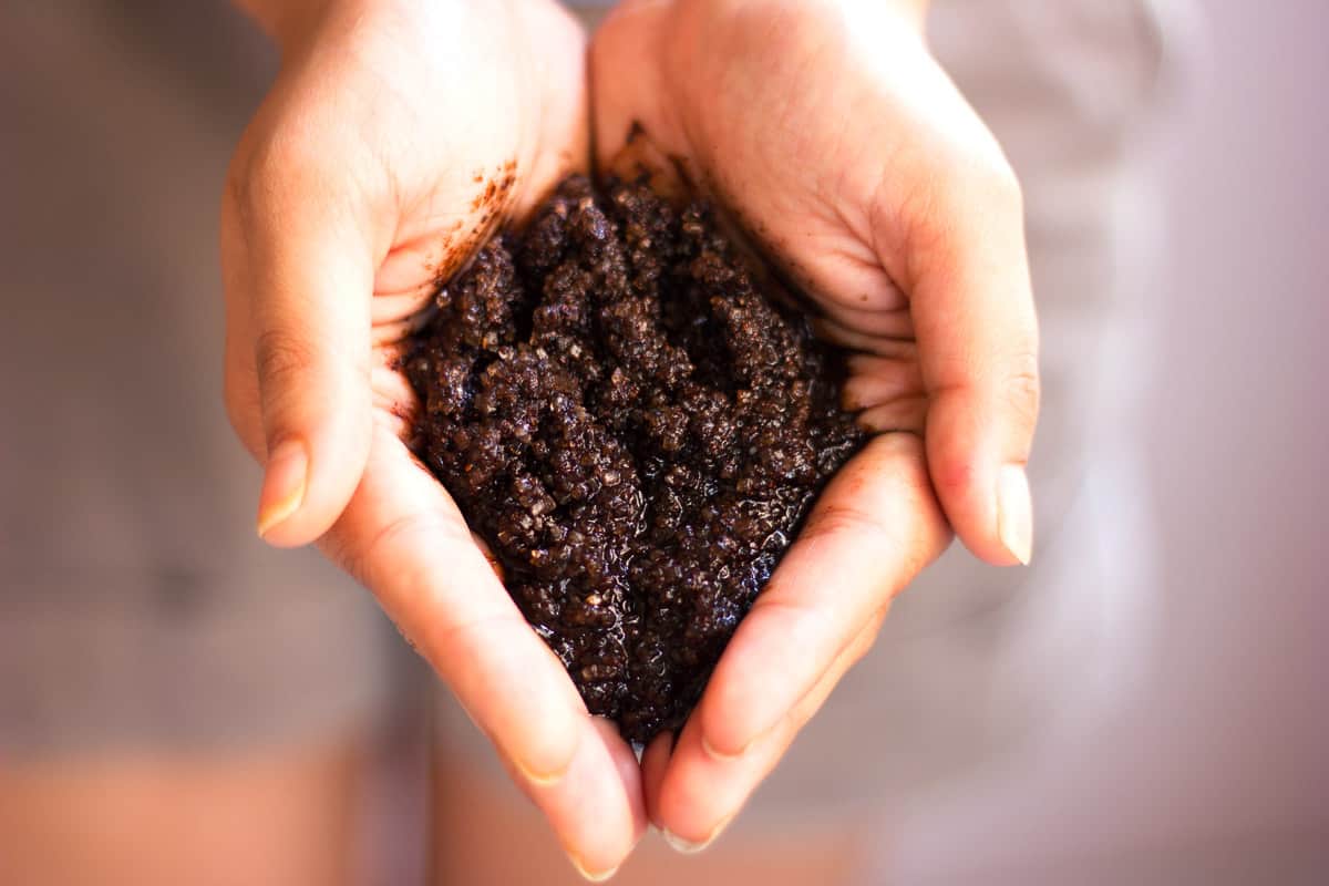 A picture of DIY Homemade Coffee Scrub in hands.