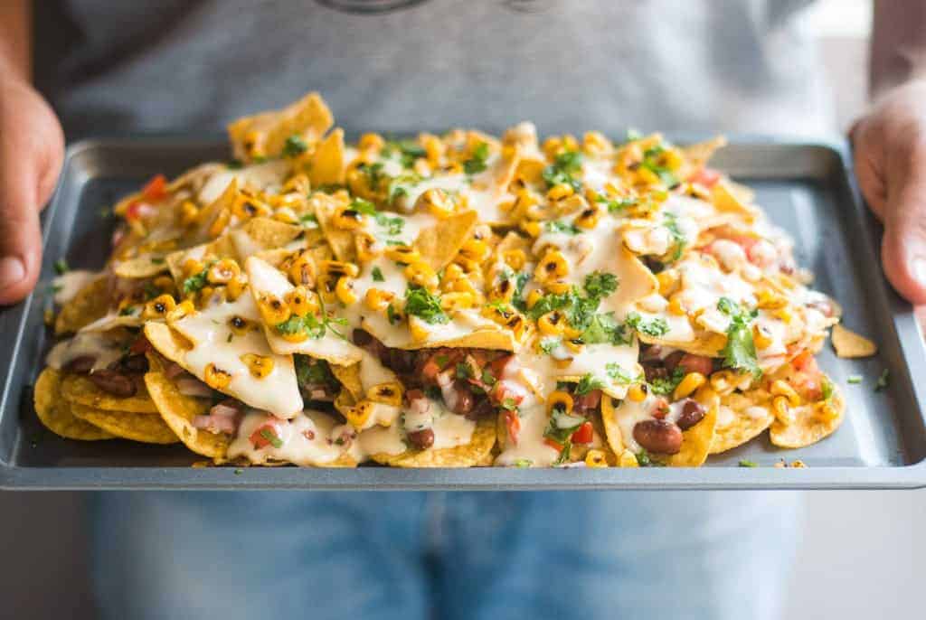 loaded nachos served in a tray