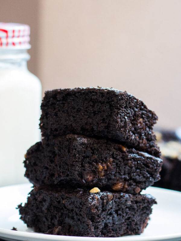 Eggless brownies stacked on top of each other.