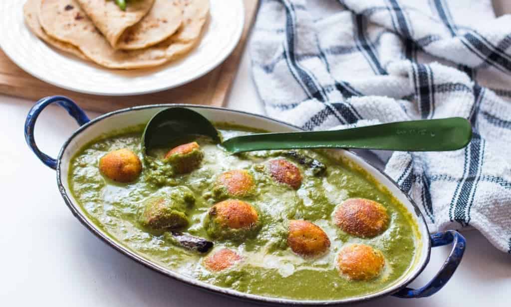 The Healthy Palak Paneer Kofta Curry served in a dish.