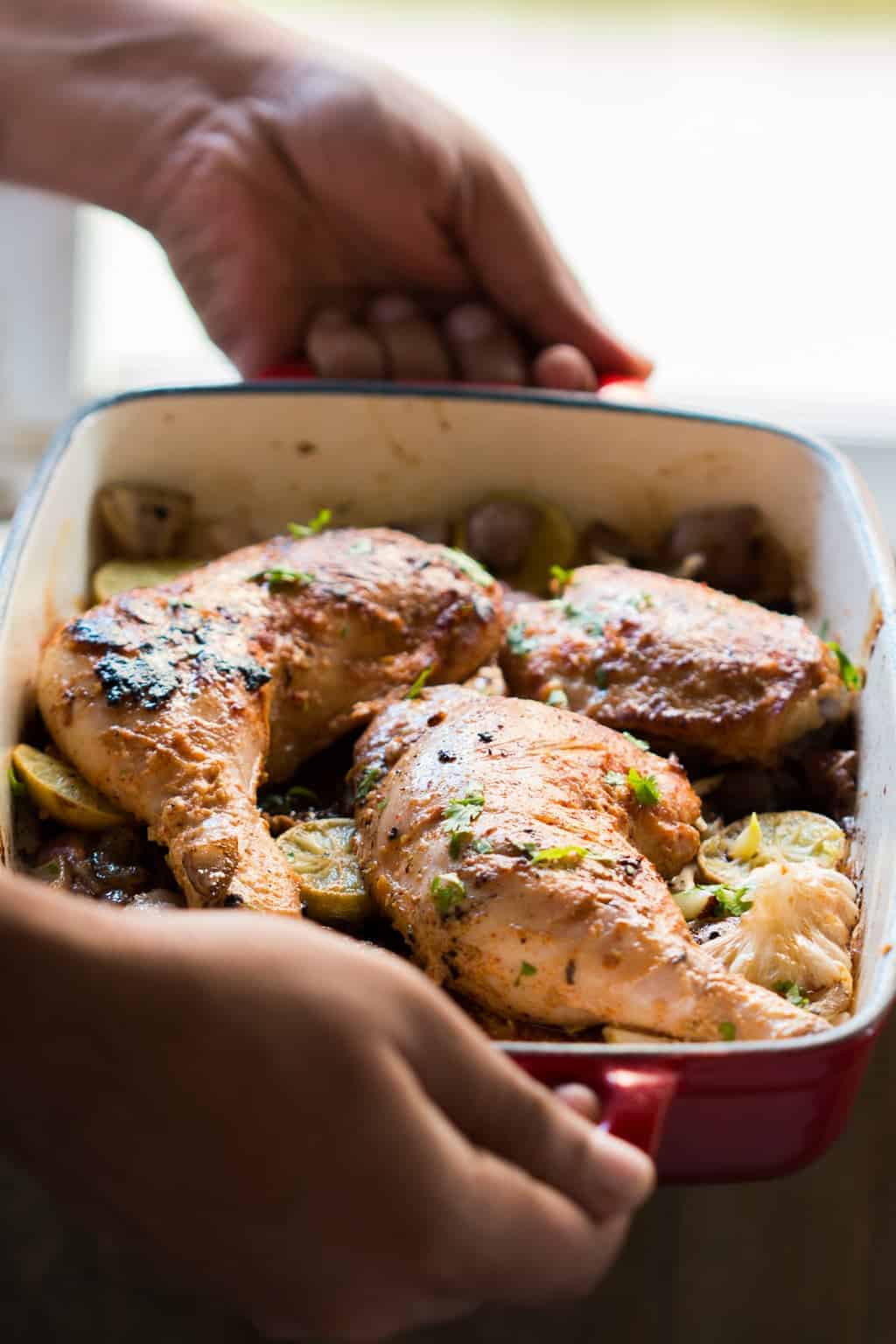 sumac chicken in a red pan