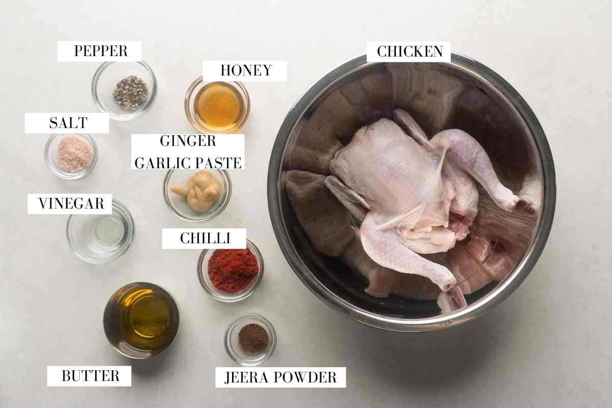 Picture of all the ingredients for Indian roast chicken with text to identify them