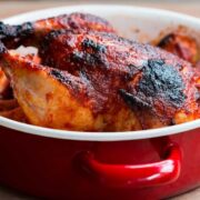 The Indian Style Whole Masala Roast Chicken in a red Fujihoro casserole.