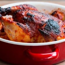 The Indian Style Whole Masala Roast Chicken in a red Fujihoro casserole.