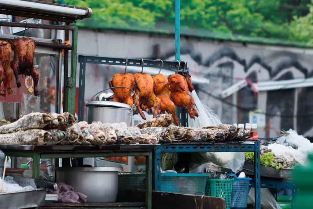 Cooked chicken being served as street food