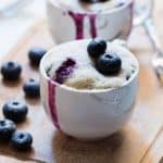 Blueberry oozing out from the Eggless Blueberry Microwave Mug Cake.