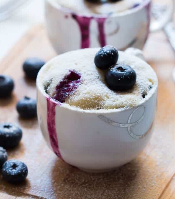 Blueberry oozing out from the Eggless Blueberry Microwave Mug Cake.