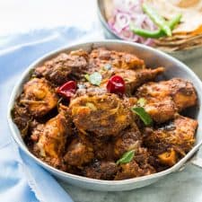 A bowl full of Spicy Chettinad Pepper Chicken Fry/Roast