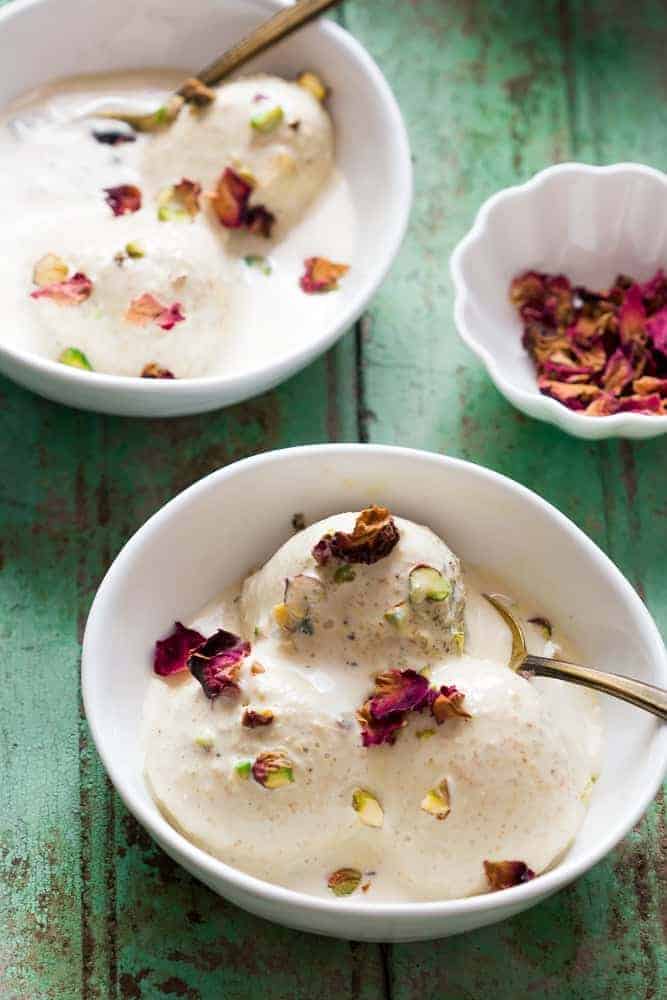 close up of scoops of thandai ice cream in a white bowl