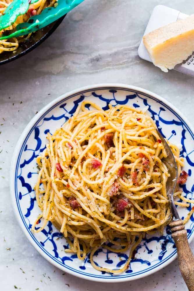 Bacon Spaghetti Aglio Olio served in white and blue plated