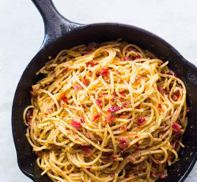 The spaghetti in a cast iron pan.