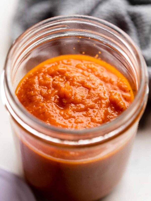 Cooked pasta sauce in a jar ready to be stored