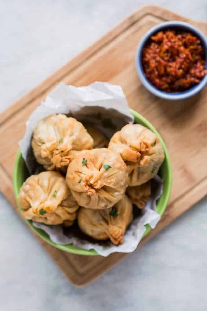 Love samosas? These vegetarian chinese potli samosa wontons are going to blow you over! I used a lo mein noodle filling but you can just as easily use shrimp, cream cheese, even chocolate to make these wontons at home. Also includes recipe for homemade samosa wrappers!