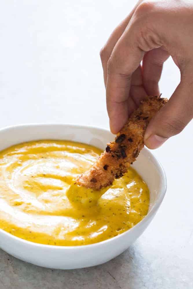 This easy tropical mango mustard dipping sauce is ready in 5 minutes and gets made in the blender. Goes really well with chicken tenders, wings, crackers, fries and chips!