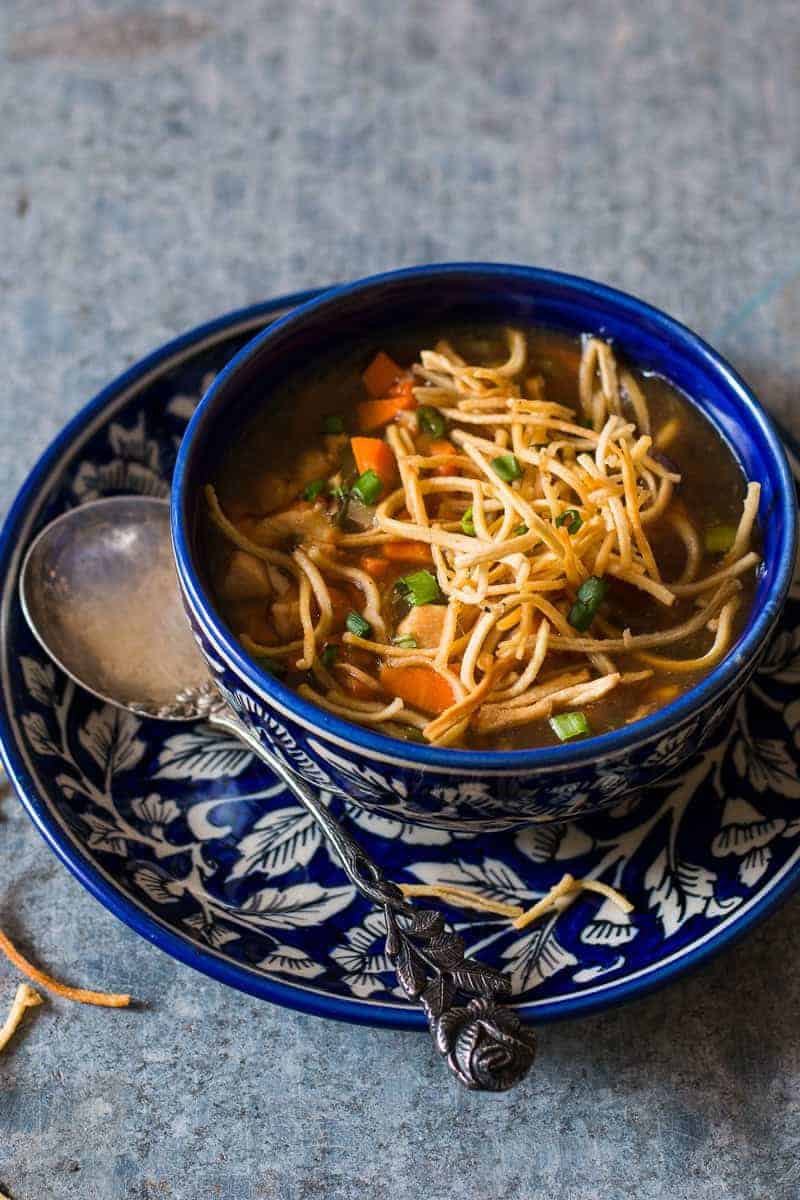 Chicken Manchow Soup is a spicy indo chinese soup, made popular by the street carts. This homemade version is an easy recipe and incredibly satisfying!