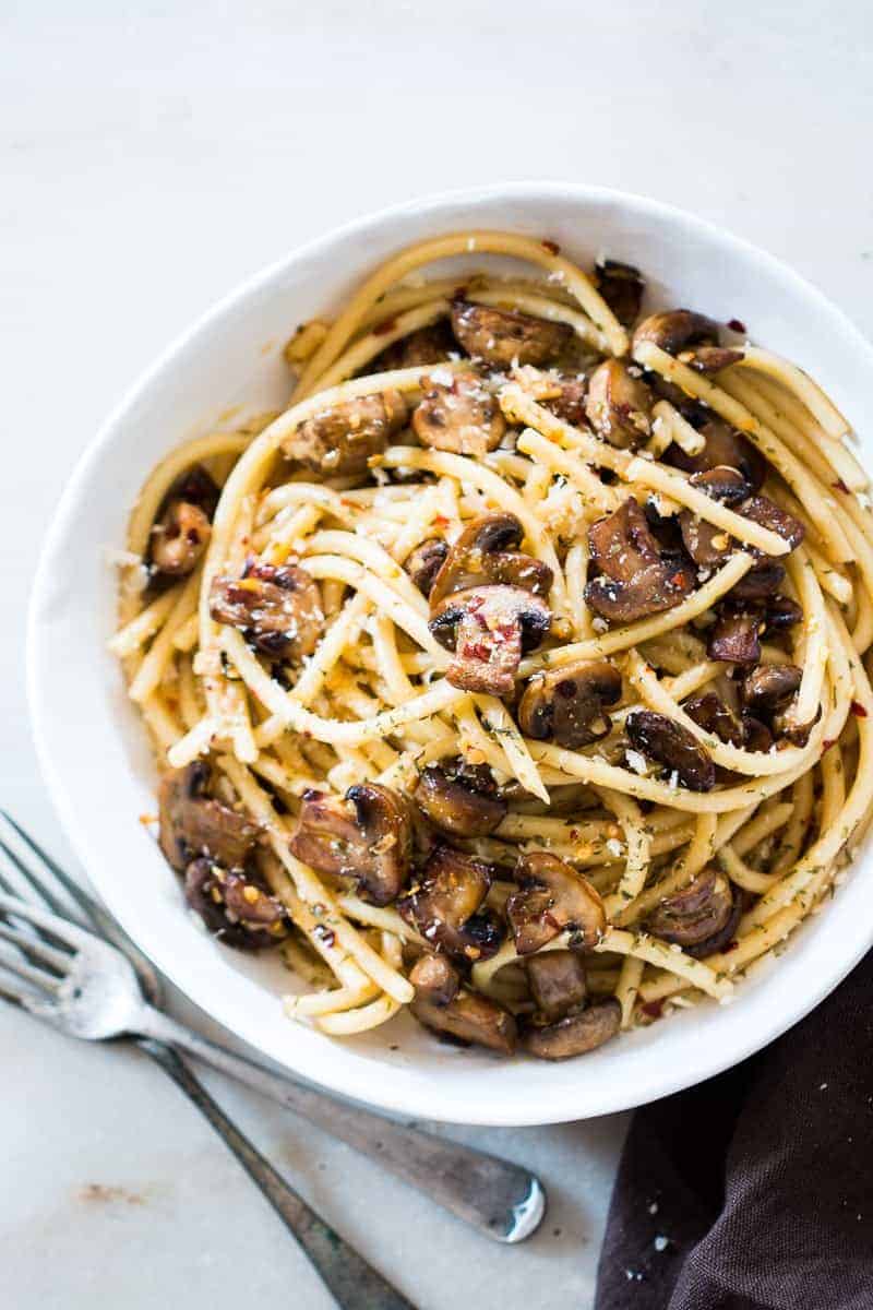 An easy, 15 minute recipe where the traditional spaghetti aglio olio is dressed up with sautéed mushrooms. Perfect for meatless weeknights and a hit with the kids!
