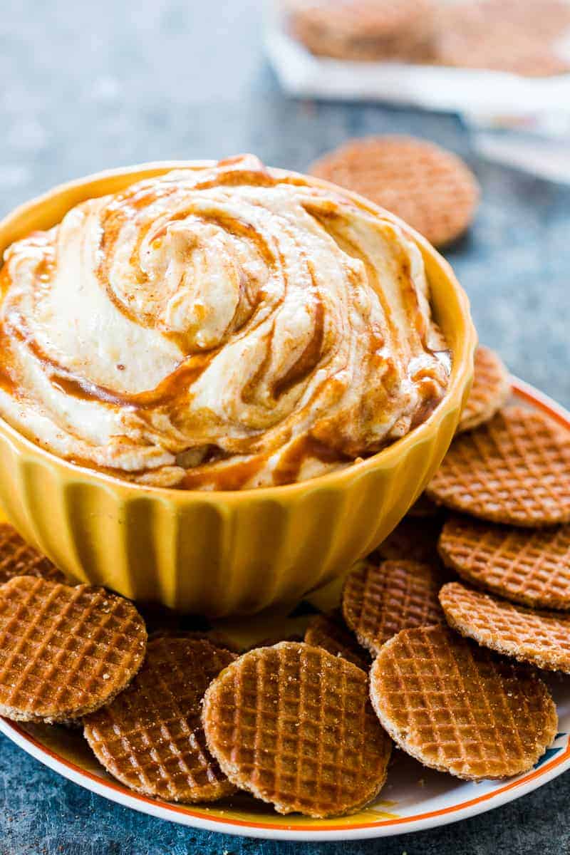 This caramel pumpkin pie cheesecake dip is a breeze to make and the perfect fall holiday appetizer or dessert. We use whipped cream instead of Cool Whip for more volume and flavour. That's one less processed ingredient for you to worry about, which makes this slightly healthier too. Serve it with graham crackers or like we did - waffle bites!