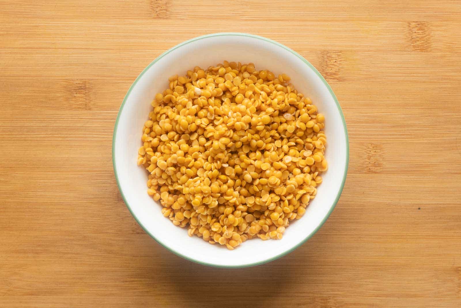 Tur dal washed and kept in a white bowl