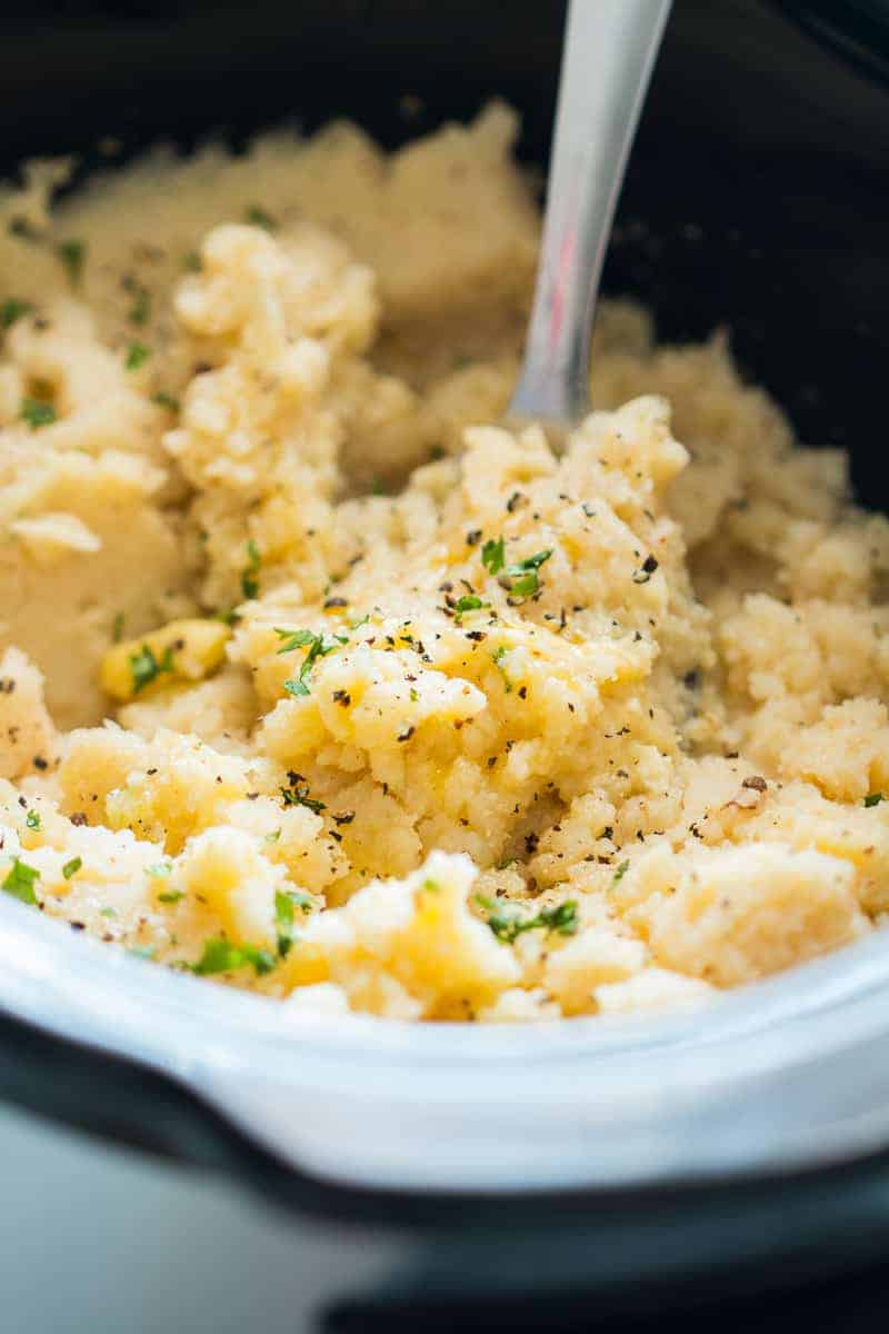 How to make the best slow cooker mashed potatoes + 4 add ins (broccoli and cheddar, bacon, brown butter and garlic and rosemary and lemon) for thanksgiving and christmas sides.