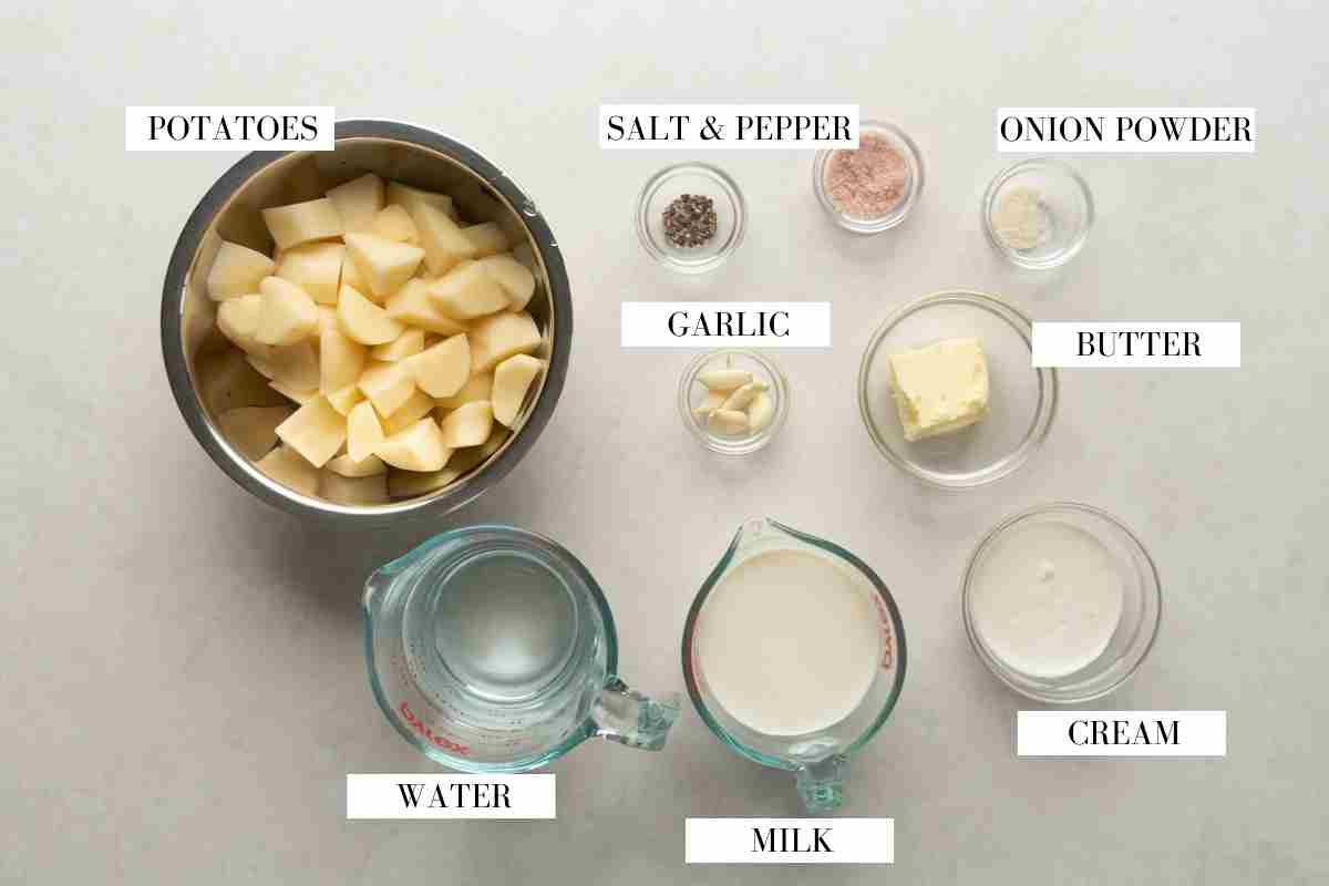 Ingredients for slow cooker mashed potatoes pictured together with text to identify each ingredient