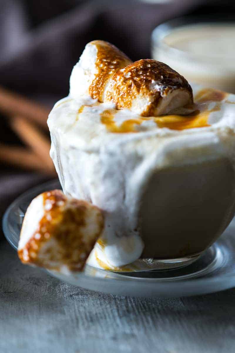 The best homemade butterbeer latte made with coffee, toffee and topped with toasted marshmallows. Just like the one you get at Starbucks!