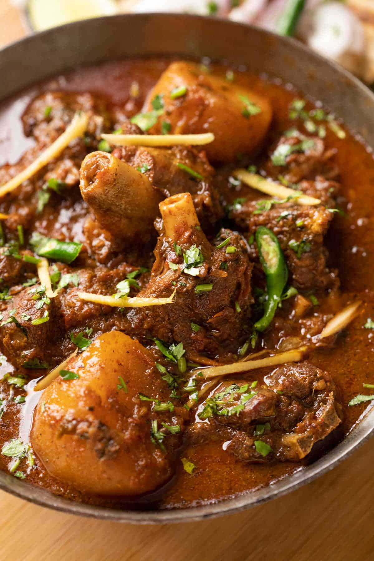 Close up of mutton shanks in the curry