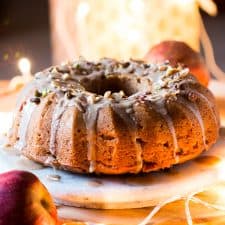 Garam Masala Eggless Apple Bundt Cake topped with a brown butter and rum glaze.
