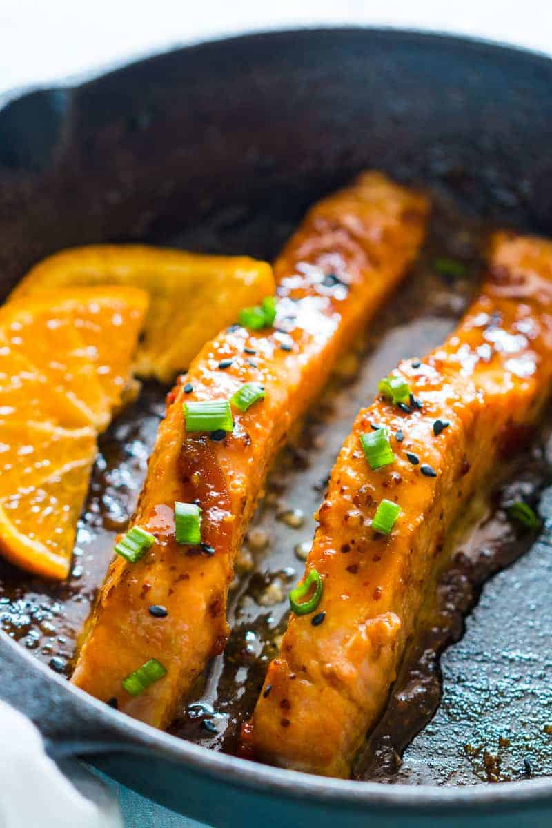 Pan seared orange mustard salmon - easy, healthy, 15 minute dinner with a sticky marinade. Clean eating ingredients, serve with pasta, cauliflower rice or asparagus.