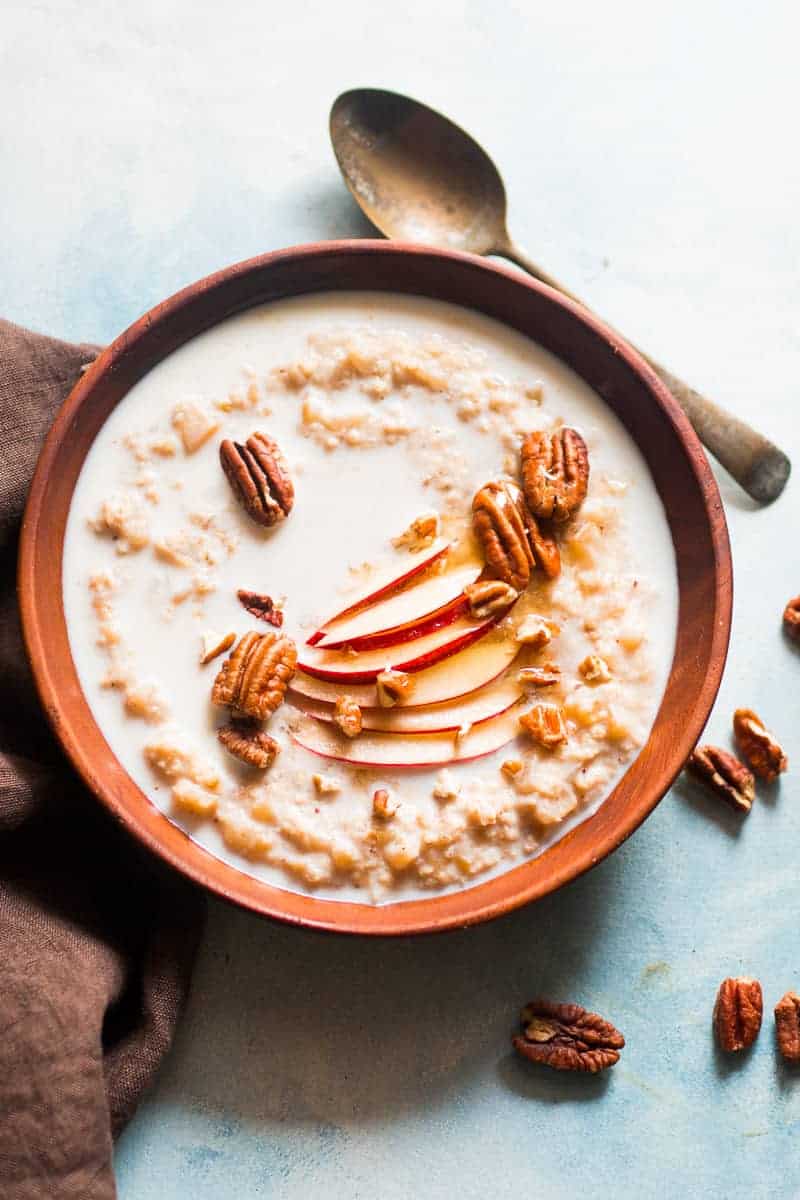 Quick and Healthy Apple Pie Oatmeal Breakfast Bowls - topped with pecan, honey and cinnamon. Stovetop recipe made with Quaker Oats.