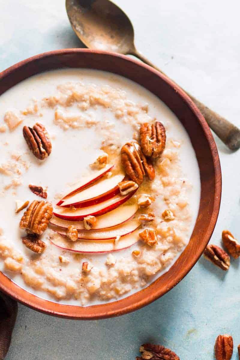 Quick and Healthy Apple Pie Oatmeal Breakfast Bowls - topped with pecan, honey and cinnamon. Stovetop recipe made with Quaker Oats.