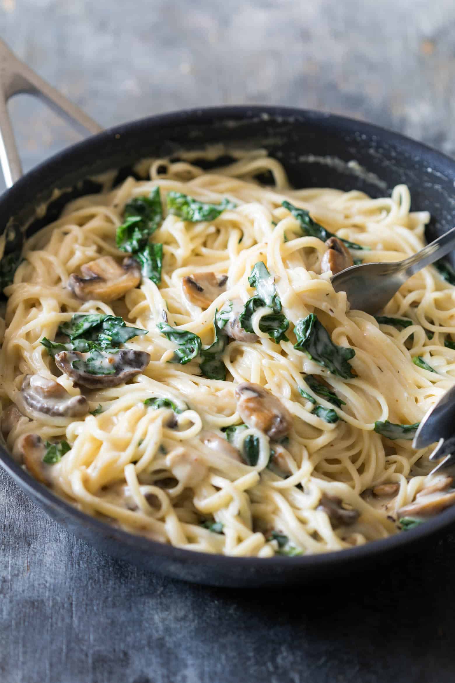 Creamy lemon mushroom kale linguine pasta is vegetarian, ready in 30 minutes with the best healthy alfredo style white sauce you'll make!