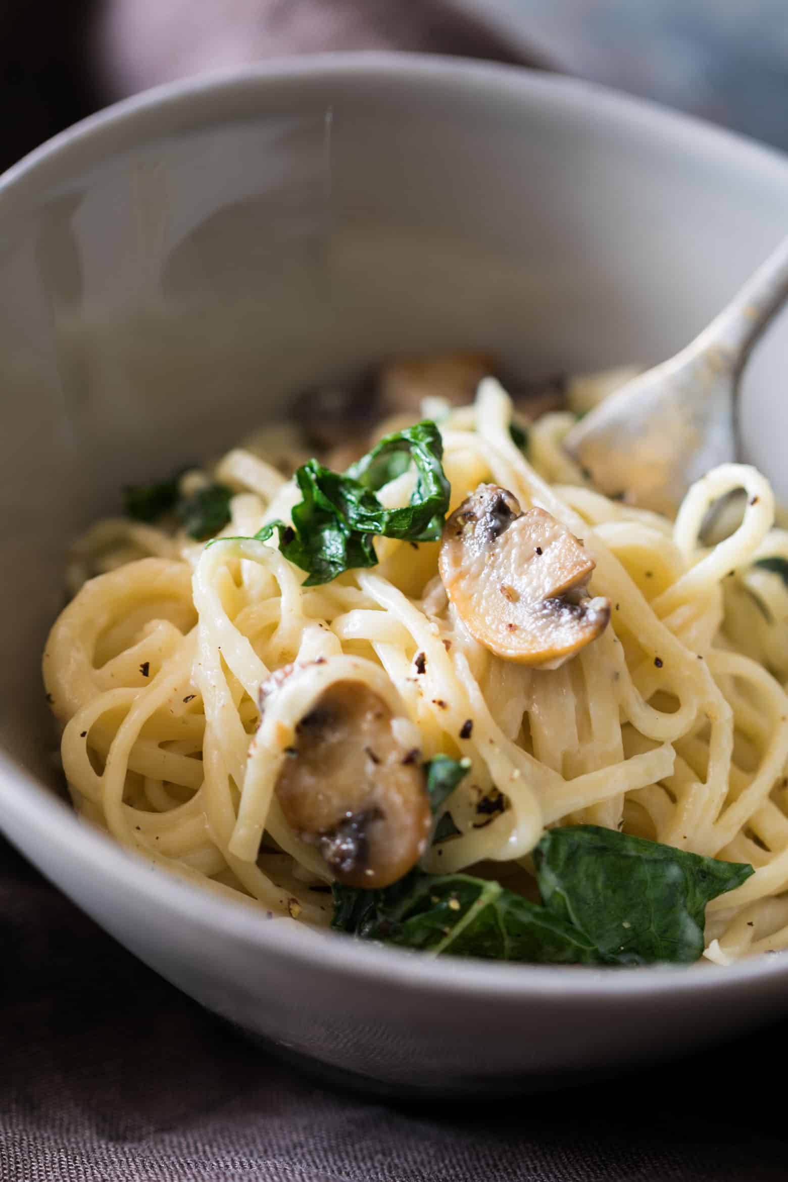Creamy lemon mushroom kale linguine pasta is vegetarian, ready in 30 minutes with the best healthy alfredo style white sauce you'll make!