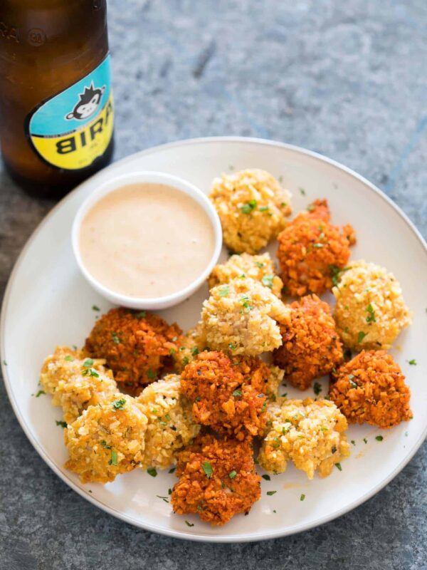 Baked popcorn chicken made 2 ways and served with sriracha mayo.