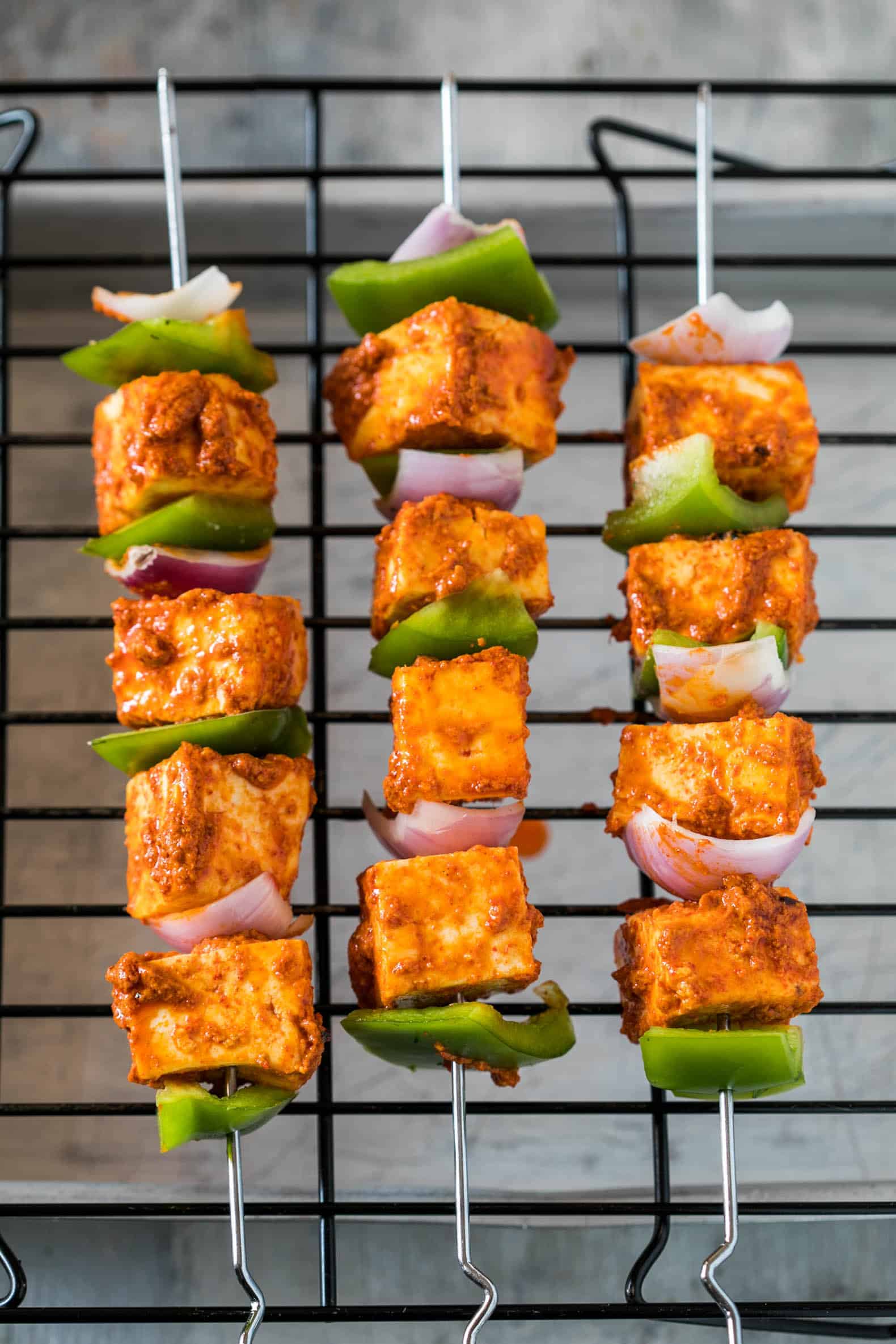 This is the best Tandoori Paneer Tikka in the oven you'll ever make at home! Same restaurant style taste, but roasted in the oven. 