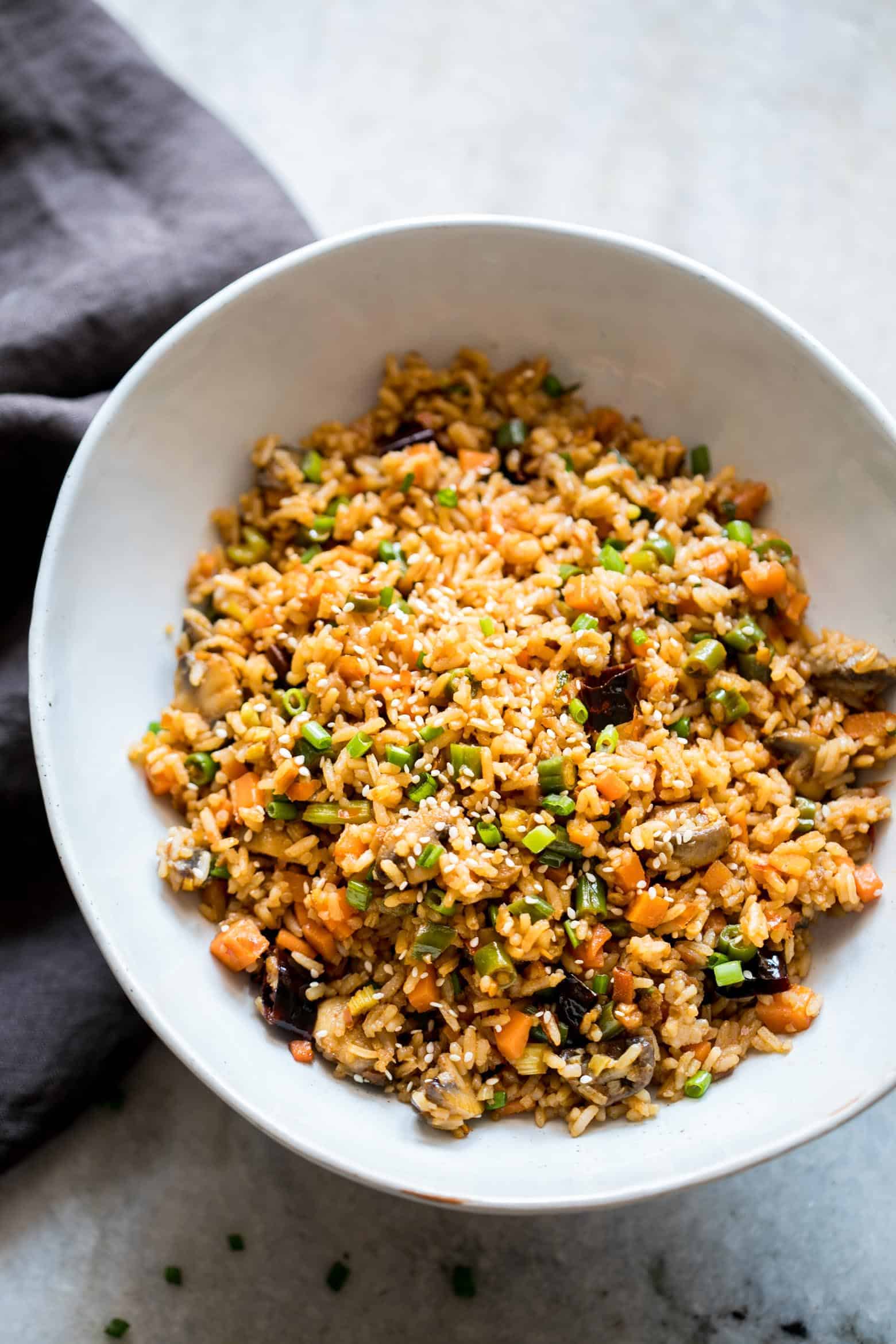 This is the best chinese schezwan fried rice you'll make - loaded with vegetables, spicy and super easy! Made with sichuan sauce, it's the best way to use leftover rice.