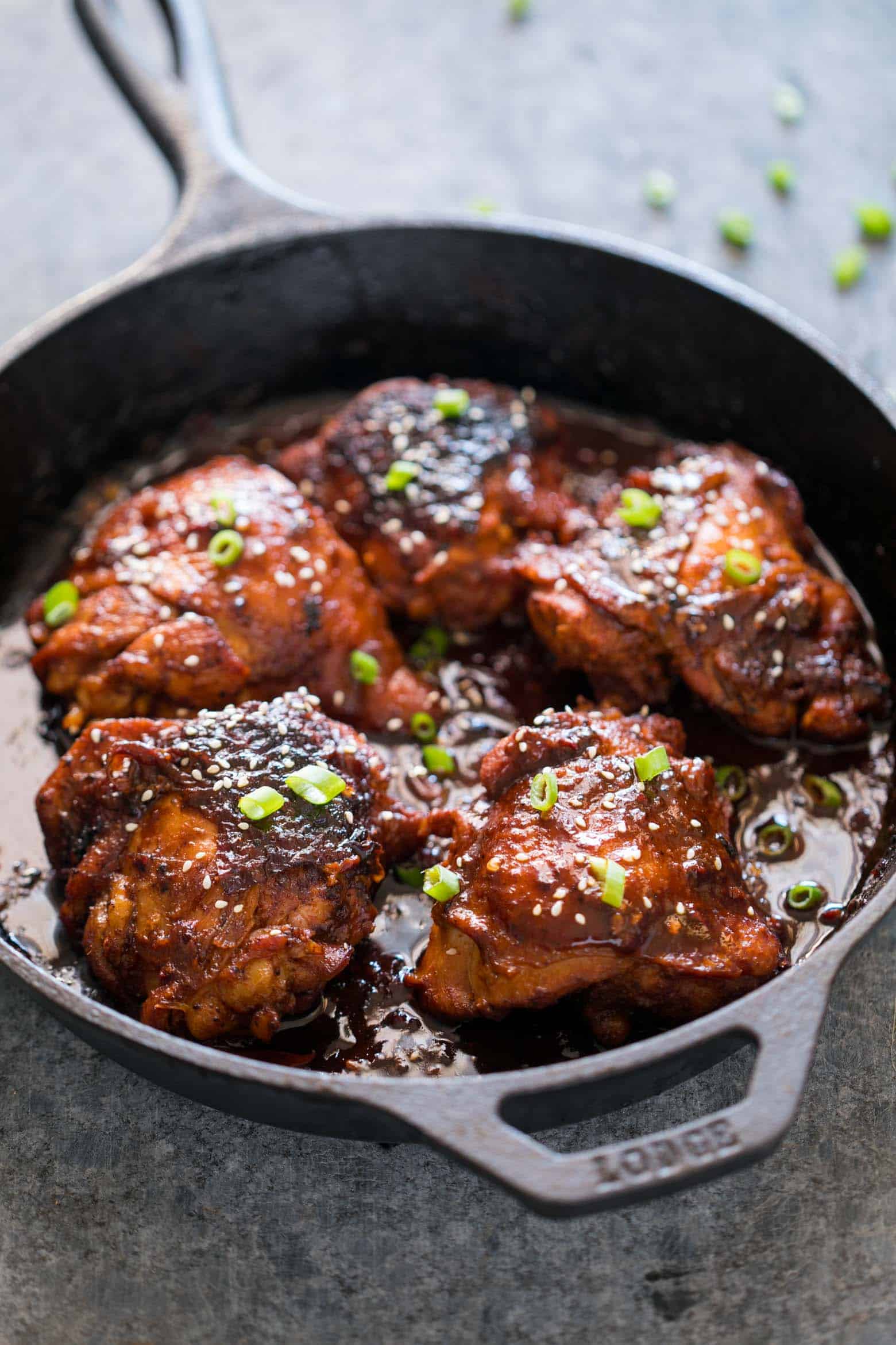 Spicy Korean Chicken Thighs in Gochujang Sauce - an intensely flavoured chicken recipe made in a cast iron pan for extra crispy, juicy thighs and a finger licking marinade!