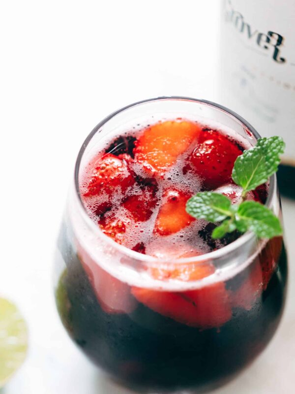 Summer Berry Red Wine Spritzer served with mint in glasses.