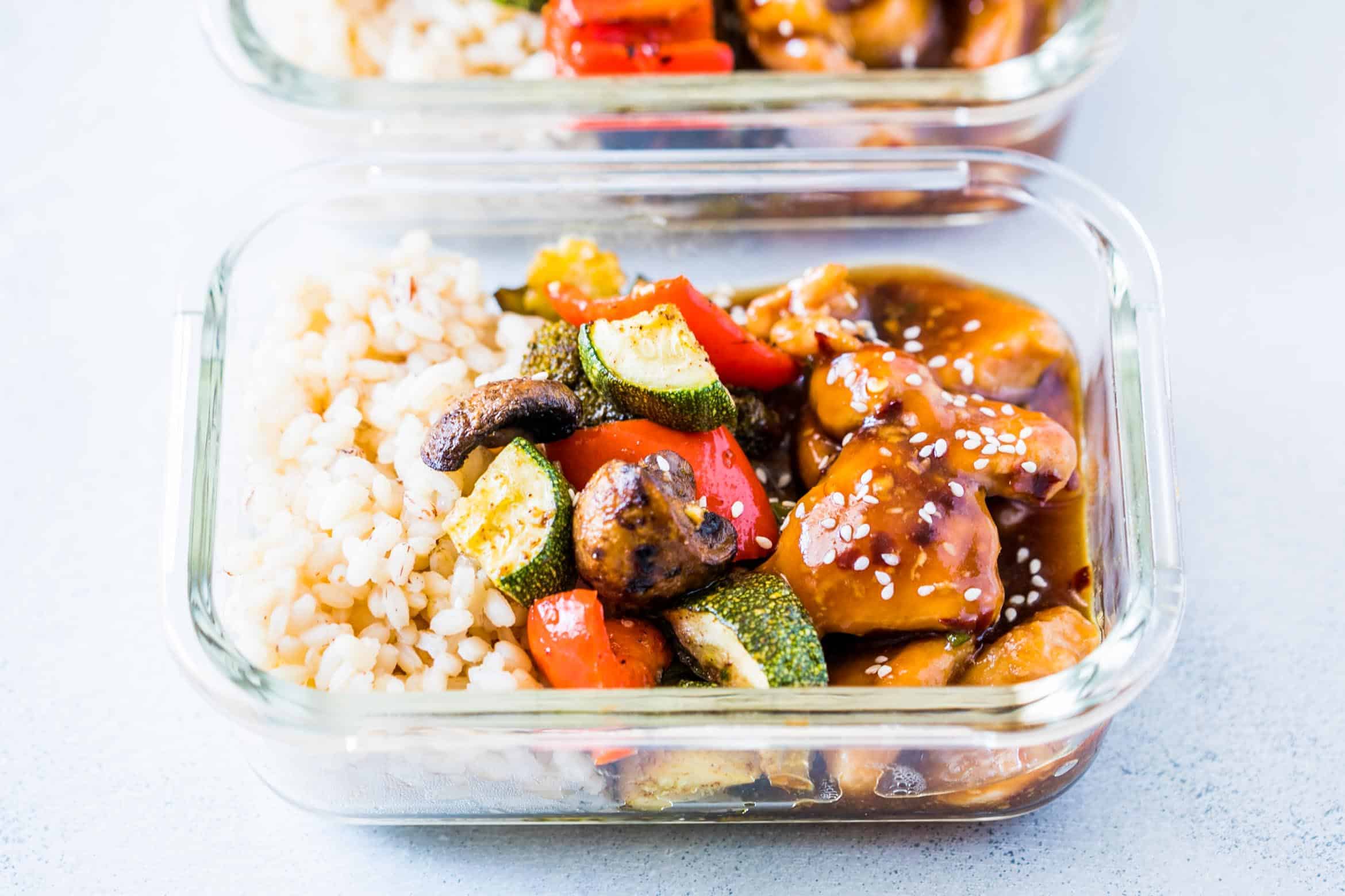 Tasty Teriyaki Chicken Stir Fry Meal Prep Lunch Boxes are the easiest way to make sure you are ready for the work week ahead. Served with brown rice and grilled vegetables, it's a balanced meal!