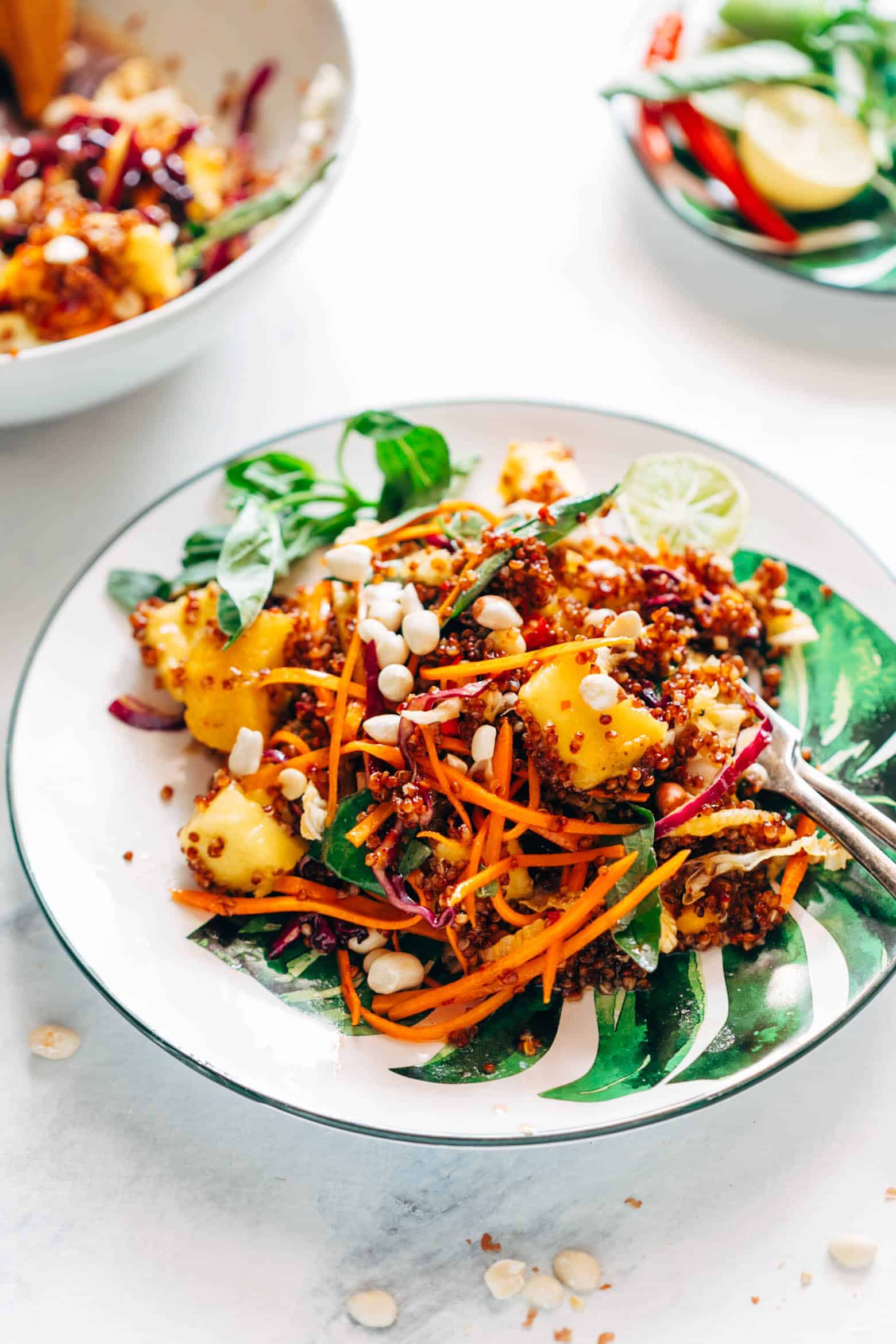 Super delicious Thai Peanut Mango Quinoa Salad which you can make ahead for potlucks and barbecues and also happens to be gluten free and vegan! Comes with a finger licking sweet and spicy sambal dressing that's different from the regular peanut dressing.