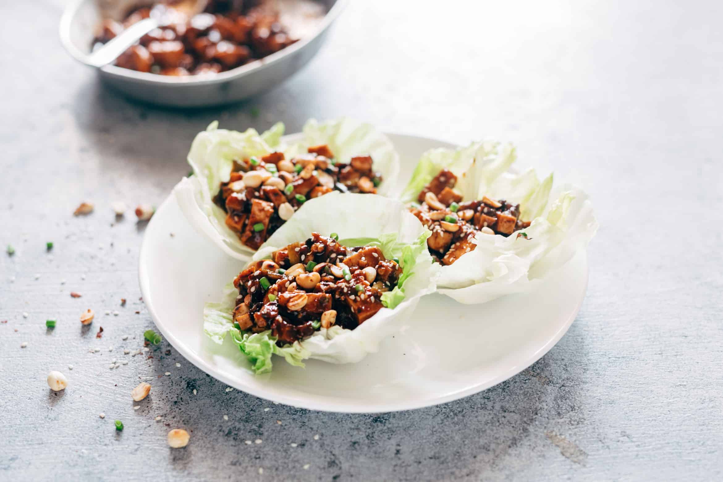 These vegetarian mapo tofu lettuce wraps double up as appetizer and dinner and use shiitake mushrooms instead of pork for that same great taste! Vegan and Gluten Free too.