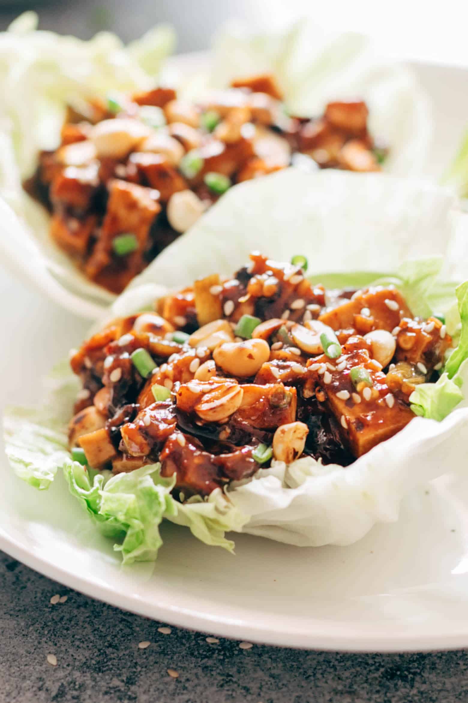These vegetarian mapo tofu lettuce wraps double up as appetizer and dinner and use shiitake mushrooms instead of pork for that same great taste! Vegan and Gluten Free too. 