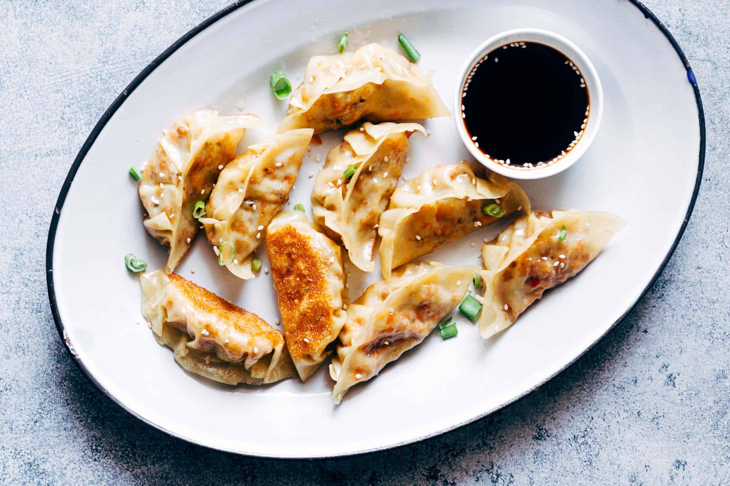 These vegetarian gyoza potstickers are stuffed with a delicious mixture of carrot, shiitake mushrooms and paneer and are insanely ease to make! Don't be intimidated because I have step by step instructions for you to make them at home.