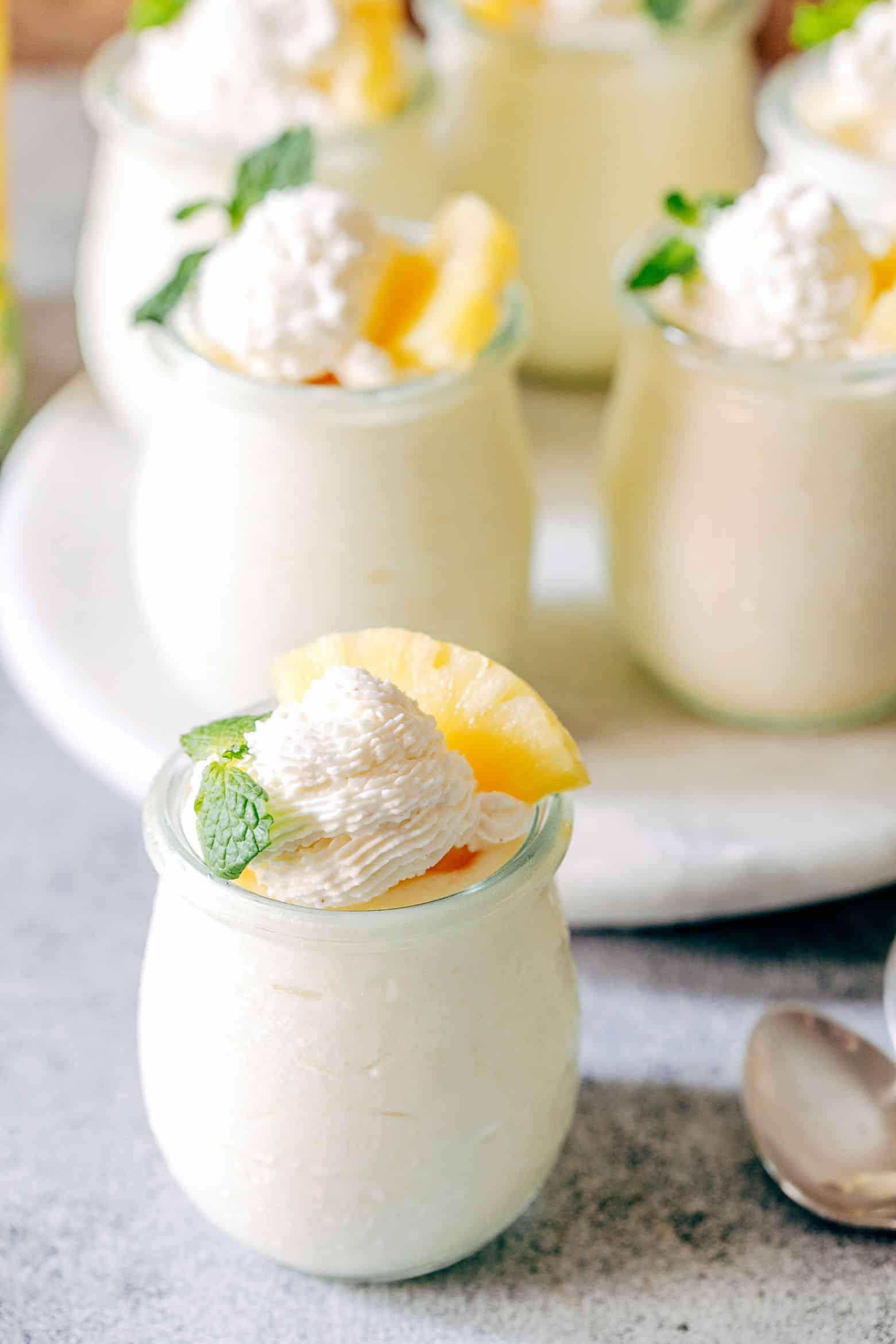 Easy eggless pineapple mousse is a delicious, make ahead dessert that will be a crowd pleaser! With minimum prep, these pineapple mousse cups are ready in minutes and have a gorgeous creamy texture.