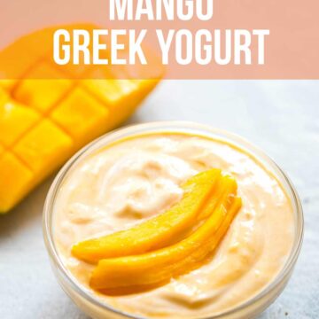 Mango greek yogurt served in a bowl with sliced mango on top